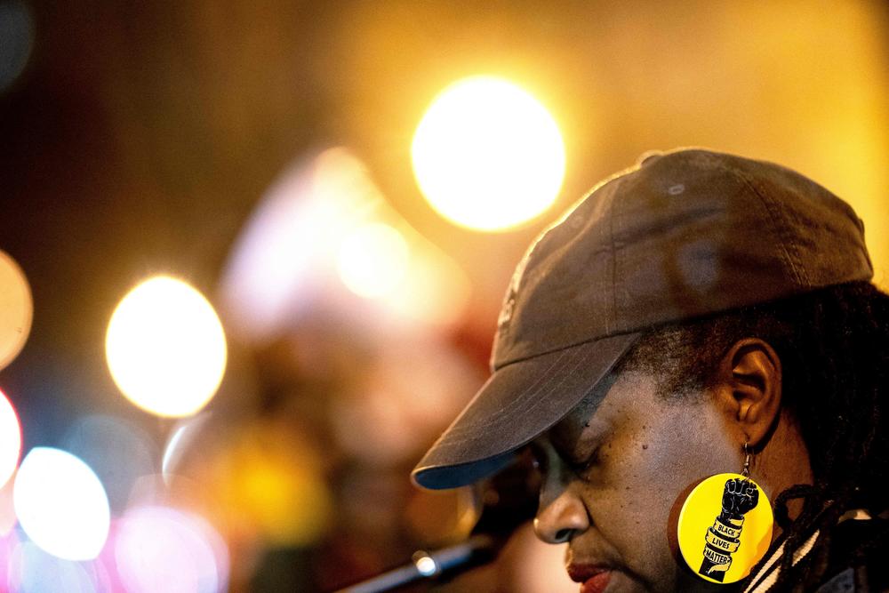 A demonstrator wears a Black Live Matter earring during a rally in Washington, D.C., against the fatal police assault of Tyre Nichols.