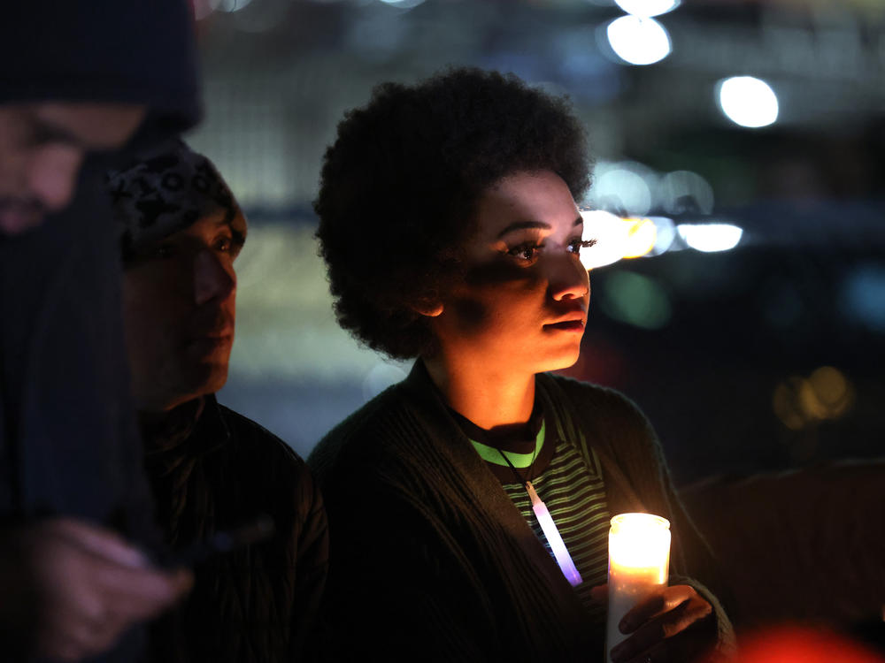 People attend a candlelight vigil in memory of Tyre Nichols on Thursday in Memphis.