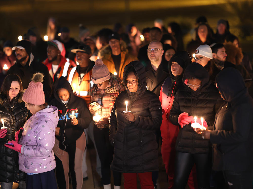 People attend a candlelight vigil in memory of Tyre Nichols at a park on Thursday in Memphis, Tenn.
