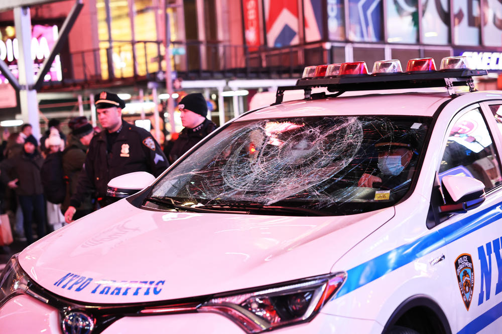 NYPD officers escort a vehicle damaged during a protest for Tyre Nichols on January 27, 2023 in New York City.