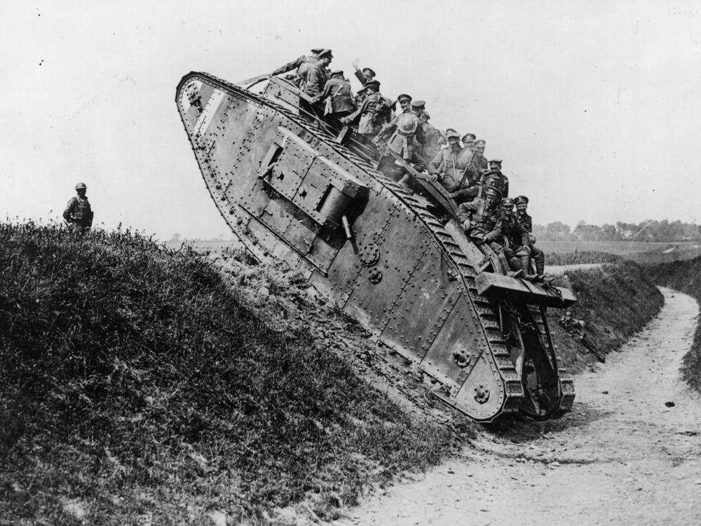 British soldiers enjoy a jaunt on a British Mark IV tank.