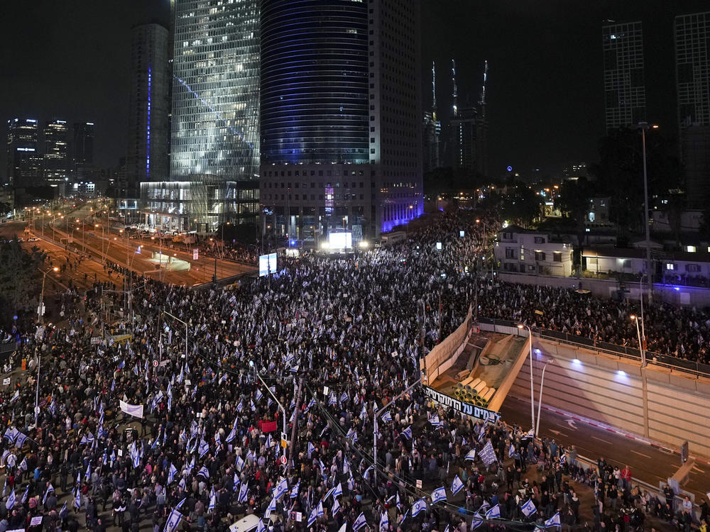 Israelis protest against the plans by Prime Minister Benjamin Netanyahu's new government to overhaul the judicial system, in Tel Aviv, Israel, Saturday, Jan. 28, 2023.