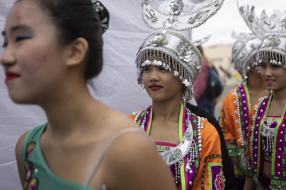 Jessie Tran and Sophia Gun wait to perform on stage at the Alhambra Lunar New Year Festival in Alhambra, Calif., on Sunday.