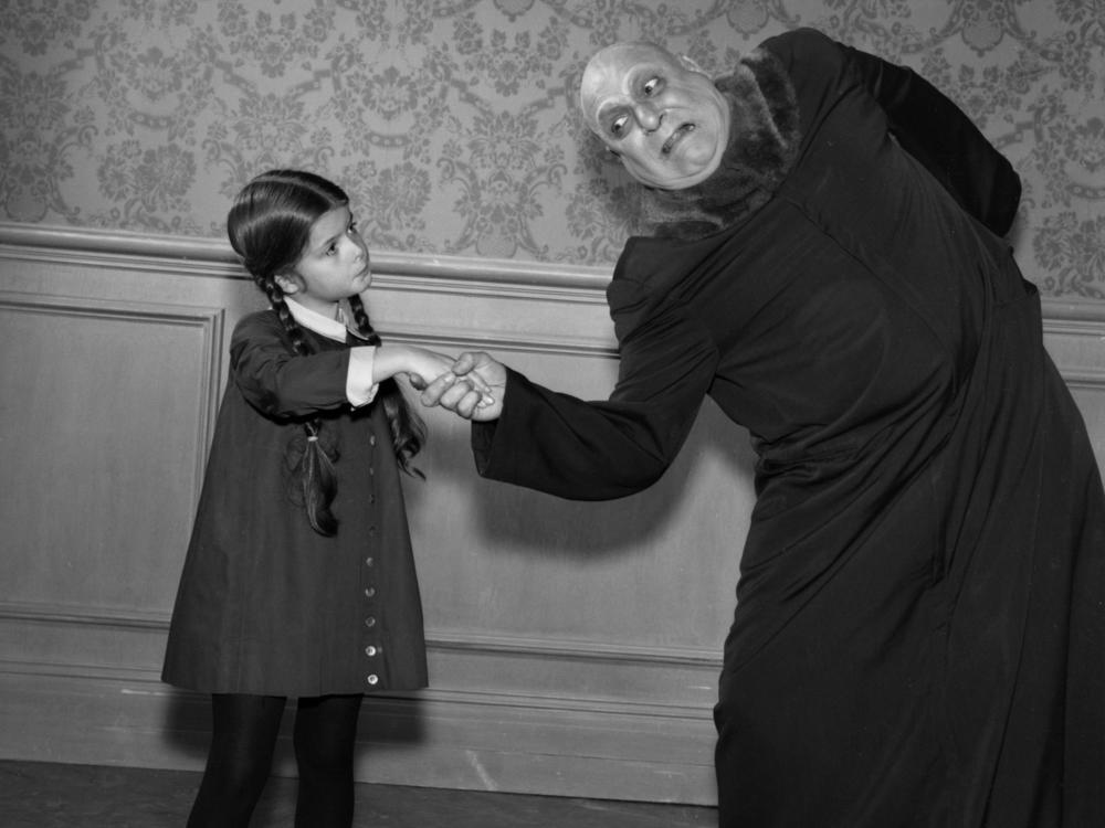 <em>The Addams Family</em> characters Wednesday and Uncle Fester. The actress who played the iconic Wednesday, Lisa Loring, died this weekend.