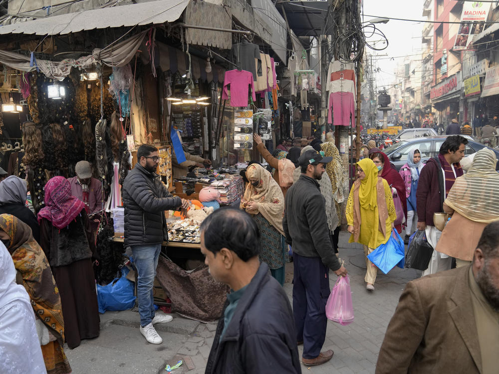 People visit a market in Lahore, Pakistan, Jan. 4. Authorities ordered shopping malls and markets to close by 8:30 p.m. as part of a new energy conservation plan aimed at easing Pakistan's economic crisis, officials said.