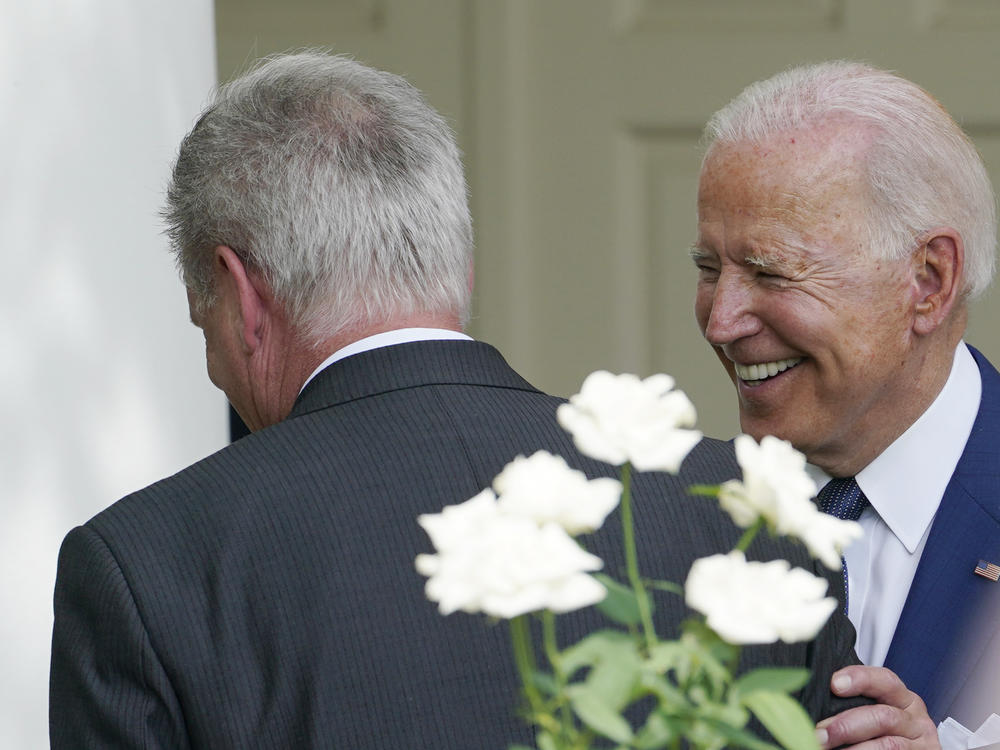 President Biden talks with Rep. Kevin McCarthy, R-Calif., after an event in the White House Rose Garden on July 26, 2021. The president and the House speaker are preparing for their first official visit at the White House on Wednesday, ahead of a looming debt crisis.