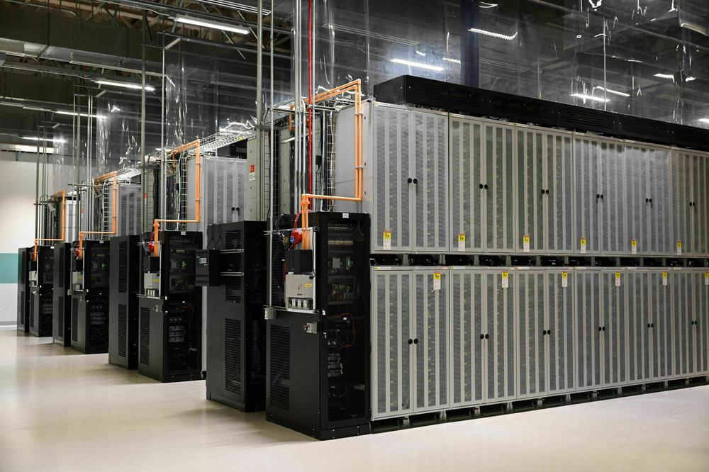 Rows of cabinets containing lithium ion batteries supplied by Fluence, a Siemens and AES Company, are seen inside the AES Alamitos Battery Energy Storage System, which provides stored renewable energy to supply electricity during peak demand periods, in Long Beach, California.