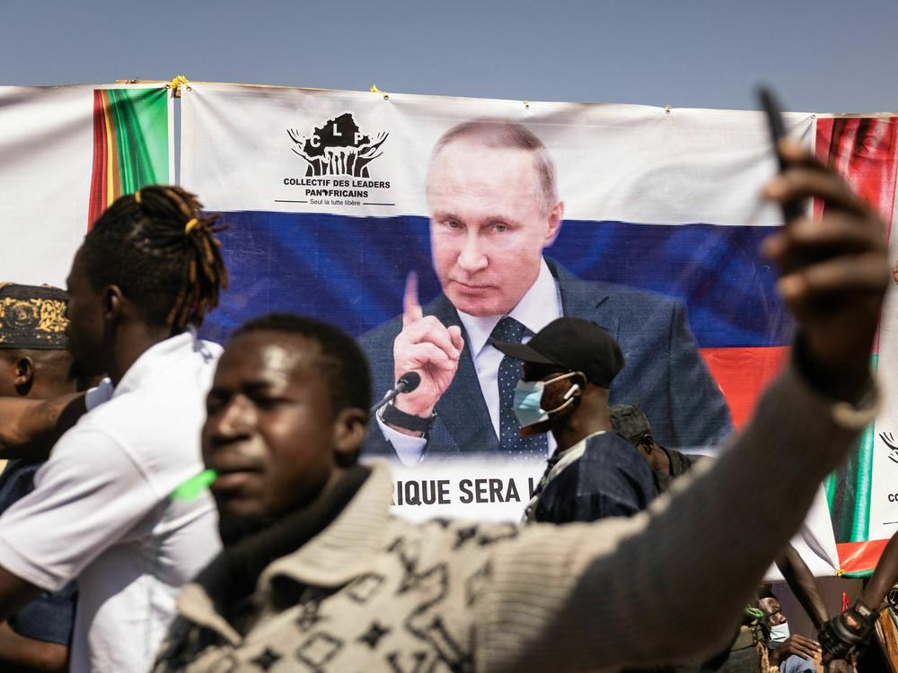 A banner of Russian President Vladimir Putin is seen during a protest to support the Burkina Faso President Captain Ibrahim Traore and to demand the departure of France's ambassador and military forces, in Ouagadougou, on Jan. 20, 2023. Russia has been trying to expand its influence throughout Africa in recent years.