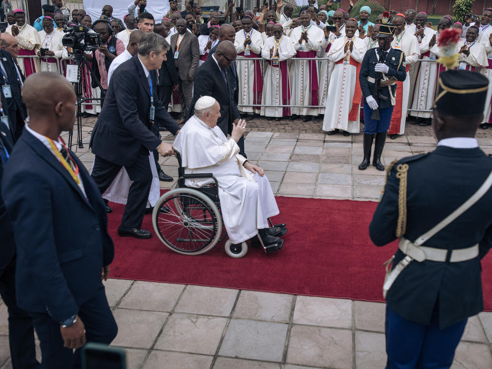 Pope Francis waves as he arrives at the N'djili International Airport in Kinshasa.