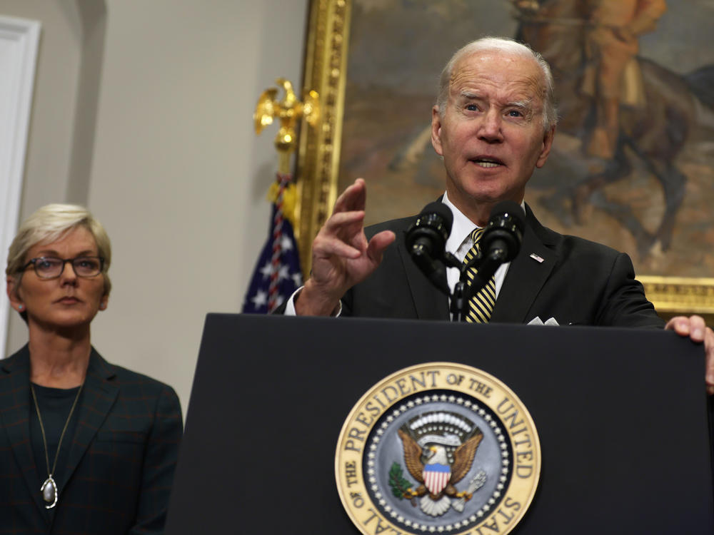 President Biden delivers remarks on energy as Secretary of Energy Jennifer Granholm listens during an event in the Roosevelt Room of the White House in Washington, D.C., on Oct. 19, 2022. Biden has threatened oil companies with a 