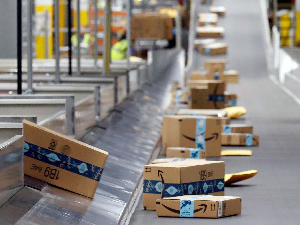 Amazon packages move along a conveyor at an Amazon warehouse in Arizona.