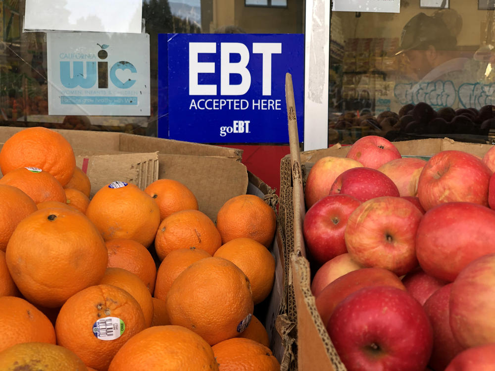 A sign noting the acceptance of electronic benefit transfer (EBT) cards, which SNAP beneficiaries use to pay for food, is displayed at a grocery store in 2019 in Oakland, Calif. SNAP emergency allotments are ending after this month and have already ended in some parts of the country.