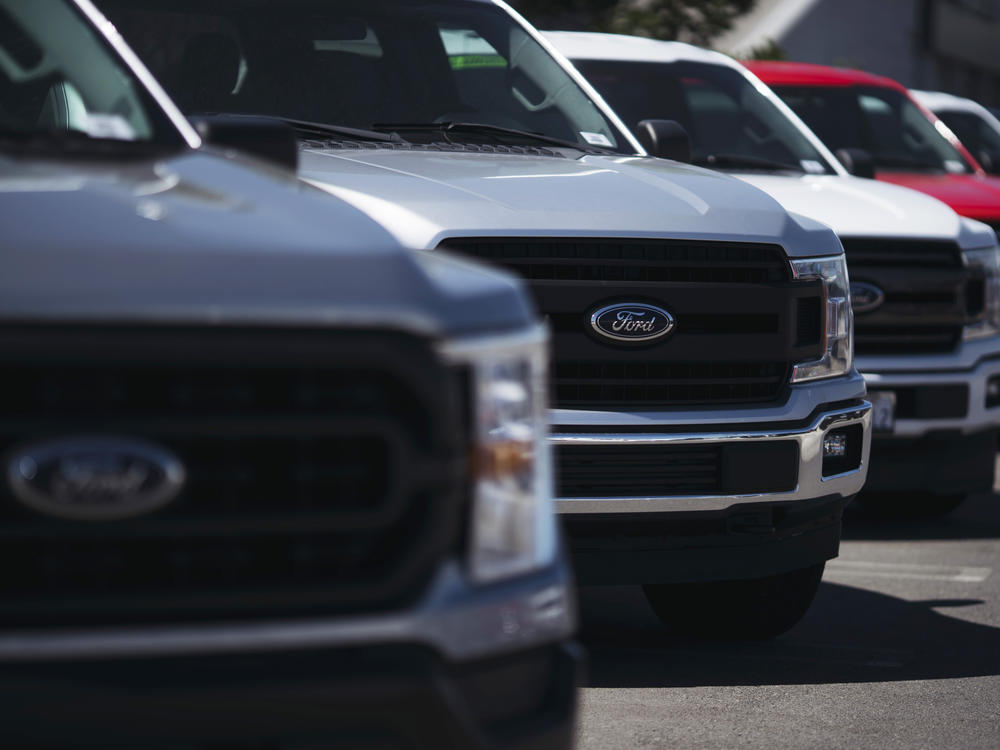 New Ford trucks are displayed at a dealership in Long Beach, Calif., on Sept. 23, 2022. Inflation has eased substantially in recent months, with car prices also coming down after staying elevated through much of the pandemic.