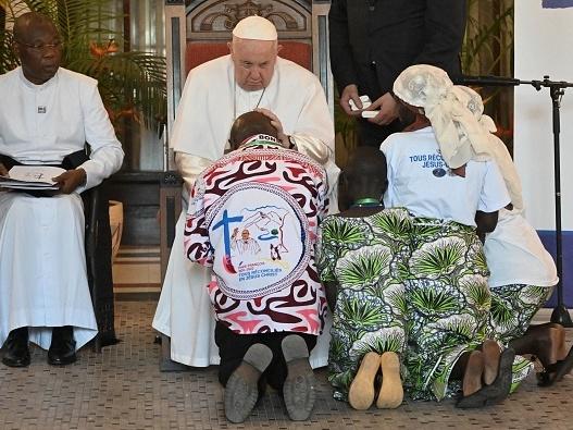 Pope Francis blesses attendees as he meets with victims of the conflict in eastern Democratic Republic of Congo at the Apostolic Nunciature in Kinshasa.