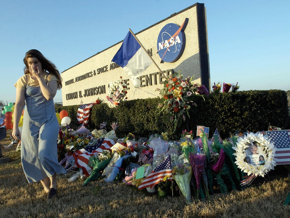 Mourners left a makeshift memorial outside NASA's Johnson Space Center in Houston after the Columbia disaster on Feb. 1, 2003.