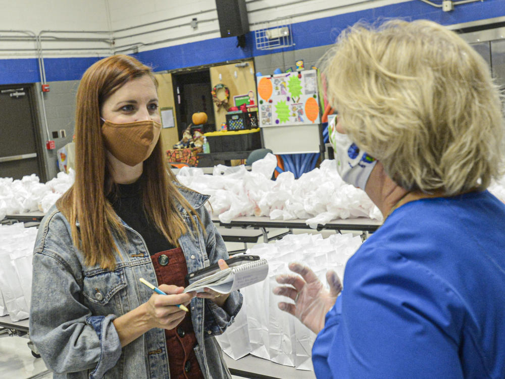 West Virginia Public Broadcasting dismissed part-time reporter Amelia Ferrell Knisely after she covered allegations of the mistreatment of people with disabilities in the state's care. Knisely (left) is shown reporting in this 2021 photograph.