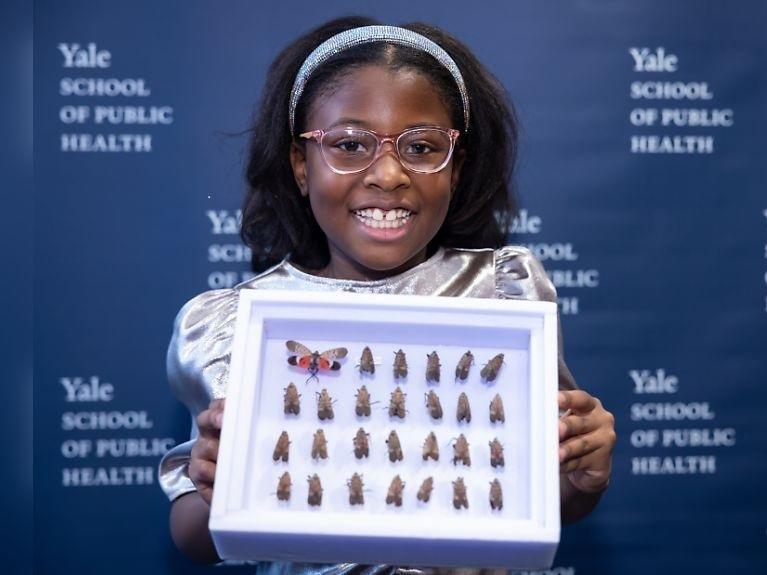 Bobbi Wilson holds her collection of spotted lanternflies as she is honored at the Yale School of Public Health on Jan. 20.