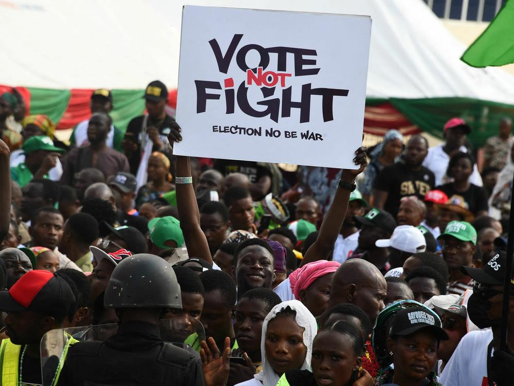 A Labour Party supporter holds a placard during a campaign rally at Adamasingba Stadium in Ibadan, southwestern Nigeria.