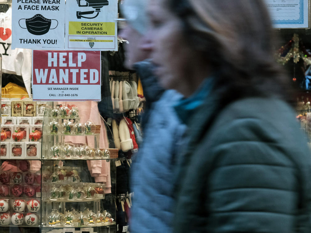 A 'help wanted' sign is displayed in a window of a store in Manhattan, New York City, on Dec. 2, 2022. U.S. employers added an unexpectedly strong 517,000 jobs in January, showcasing the labor market is red-hot. The unemployment rate fell to its lowest level in more than half a century.