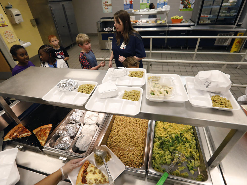 A teacher lines up the students for school-prepared lunches at Madison Crossing Elementary School in Canton, Miss. in 2019. The USDA unveiled new nutrition standards for school meals that would limit sugar and sodium.