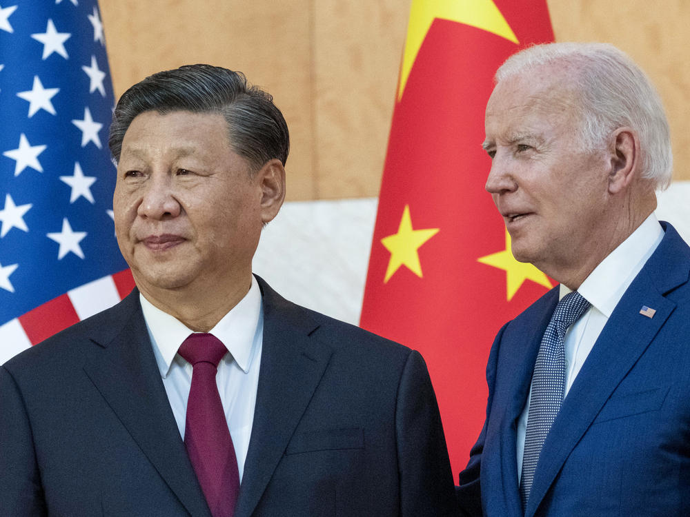 President Biden stands with Chinese President Xi Jinping before a meeting on the sidelines of the G-20 summit meeting, Nov. 14, 2022, in Bali, Indonesia.