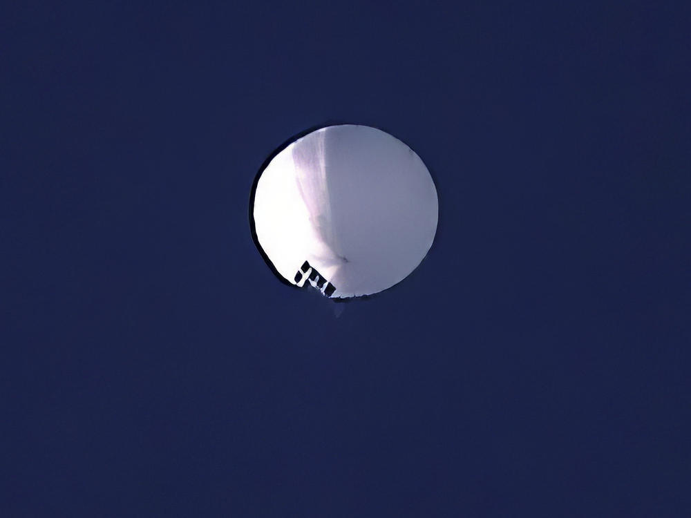 A high altitude balloon floats over Billings, Mont., on Wednesday. The U.S. is tracking a suspected Chinese surveillance balloon that has been spotted over U.S. airspace.