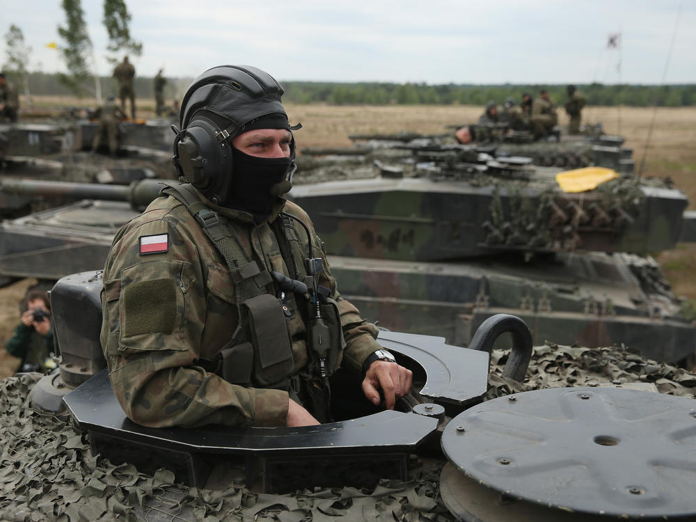 Soldiers of the Polish Army man their Leopard 2 tanks during the NATO Noble Jump military exercises of the VJTF forces on June 18, 2015 in Zagan, Poland.