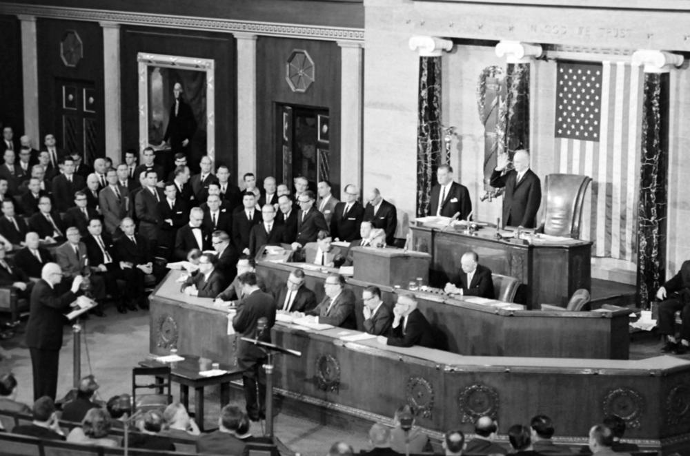 President Lyndon B. Johnson outlines his program and expresses a desire to travel to Europe in his State of the Union address to both houses of the United States Congress meeting in session common at the Capitol on Jan. 7, 1965 in Washington, D.C.