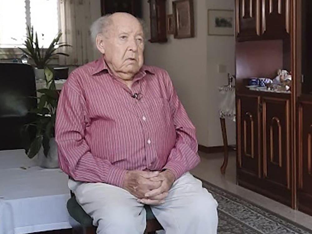 This undated photo provided by Yad Vashem Holocaust Memorial shows Shlomo Perel at his home in Givatayim, Israel. Perel, who survived the Holocaust through surreal subterfuge and an extraordinary odyssey that inspired his own writing and an internationally renowned film, has died. He was 98.