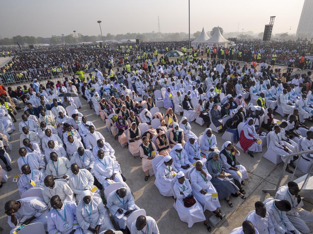 Nuns and priests attend a Holy Mass led by Pope Francis at the John Garang Mausoleum in Juba, South Sudan Sunday, Feb. 5, 2023.