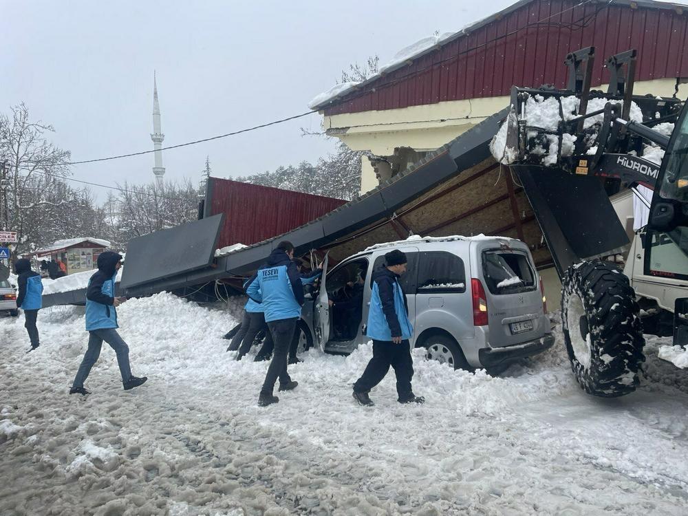 A view of a destroyed building in Turkey's southern province of Kahramanmaras on Monday. Heavy snow in the region is complicating search efforts.