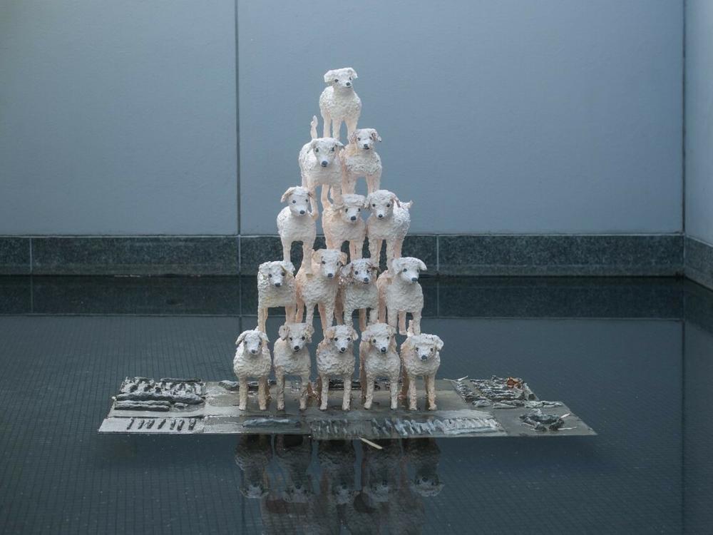 Sahar Khoury's <em>Untitled (15 Esthers in pyramid on bone relief plinth)</em>, 2018, Glazed ceramic, steel, cement, resin