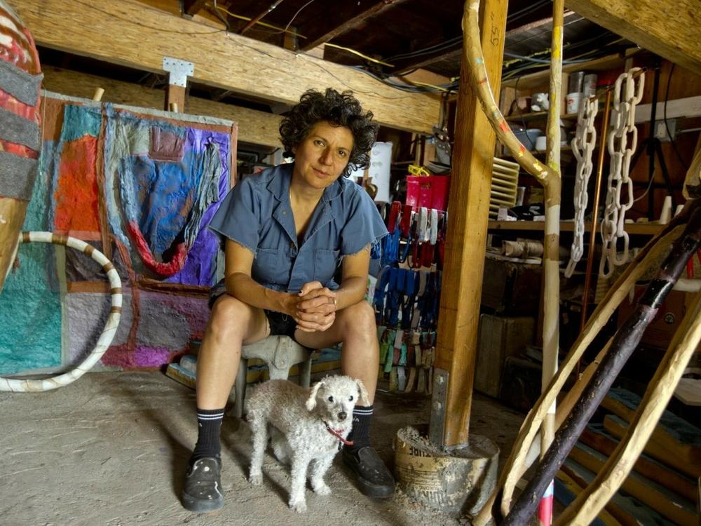Artist Sahar Khoury with her dog Esther, 2018. The Oakland, Calif.-based sculptor has created many artworks featuring Esther and her other pets.