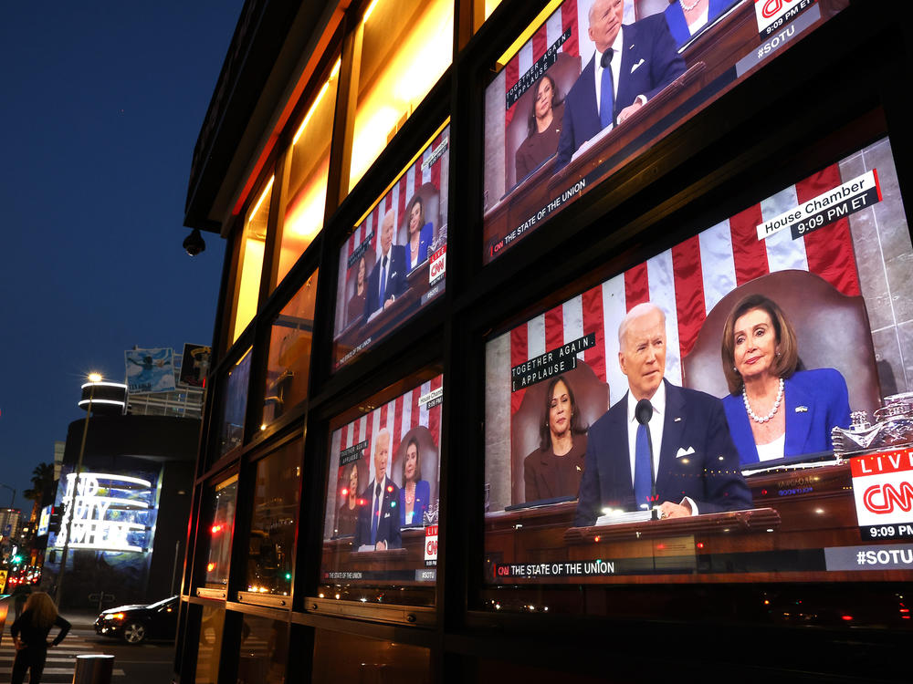 Televisions broadcast President Joe Biden as he delivers his State of the Union address last year.