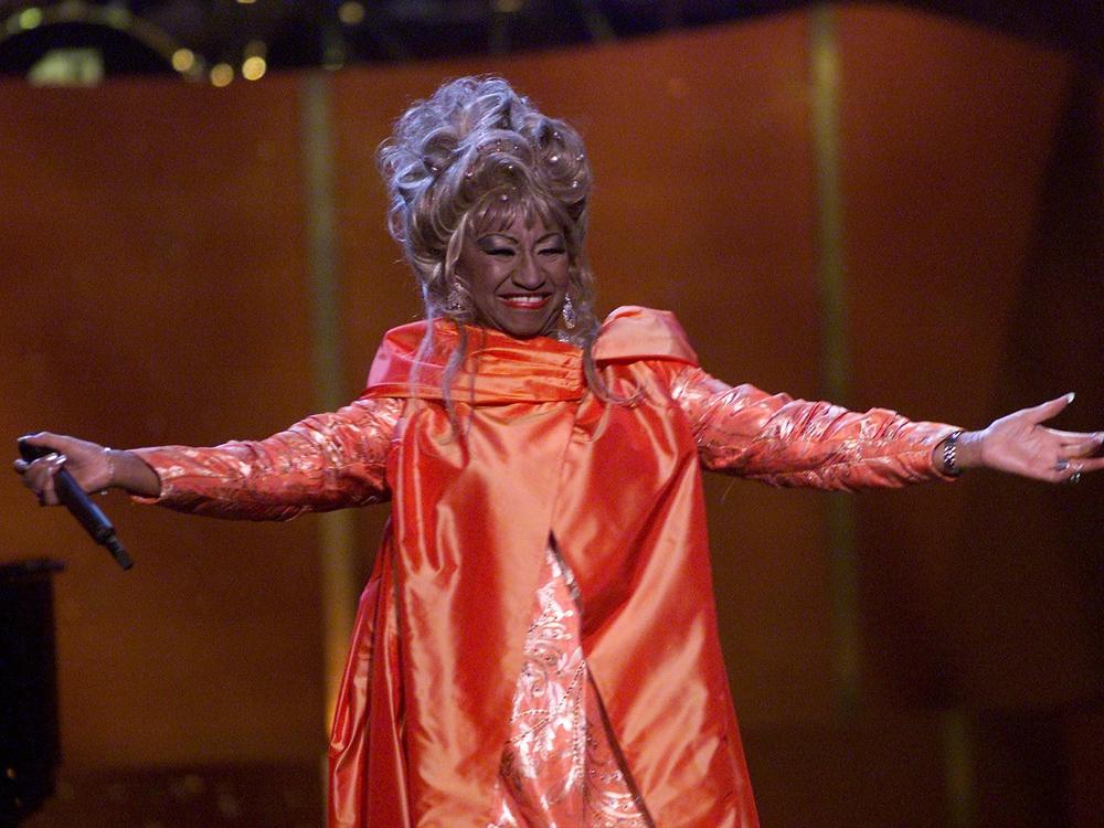Cuban American salsa singer Celia Cruz onstage performing at <em>VH1 Divas Live: The One and Only Aretha Franklin</em> in New York City in 2001. Cruz is being honored on the U.S. quarter in 2024.