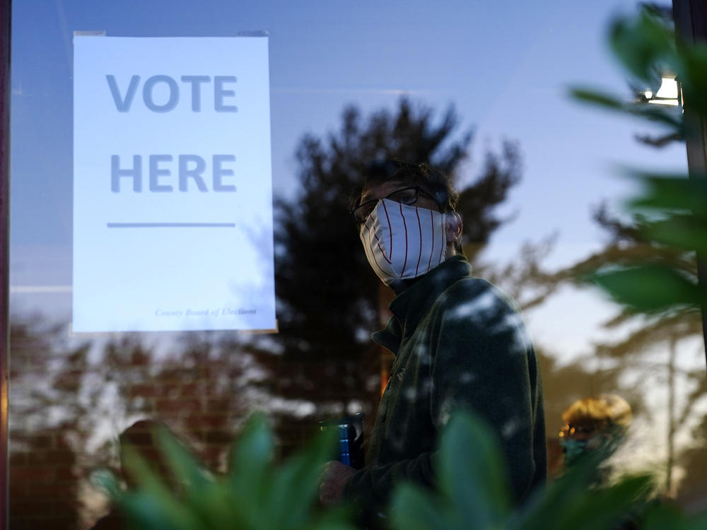 A voter lines up in a polling place to cast a ballot for the 2020 general election in Springfield, Pa., which is located in the Philadelphia suburb of Delaware County.