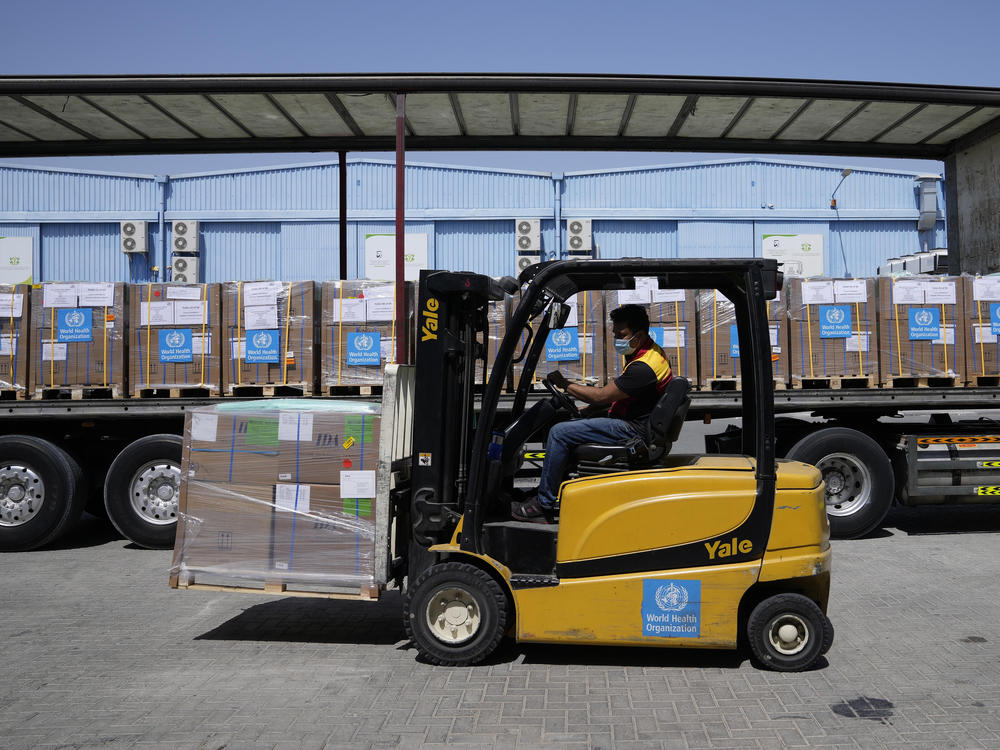 A forklift driver loads healthcare materials to be sent to Ukraine at the UNHCR warehouses, part of the International Humanitarian City in Dubai, United Arab Emirates, in March 2022.