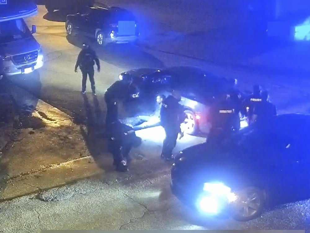 In this image from video released and partially redacted by the city of Memphis, Tenn., on Jan. 27, 2023, Tyre Nichols leans against a car after a brutal attack by five Memphis Police officers on Jan. 7, in Memphis.