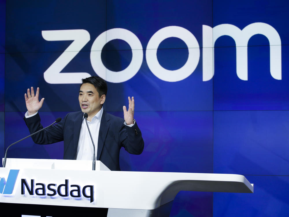 Zoom CEO and founder Eric Yuan speaks before the Nasdaq opening bell ceremony in April 2019. The company saw rapid growth during the pandemic but is now laying off about 15% of its workforce.