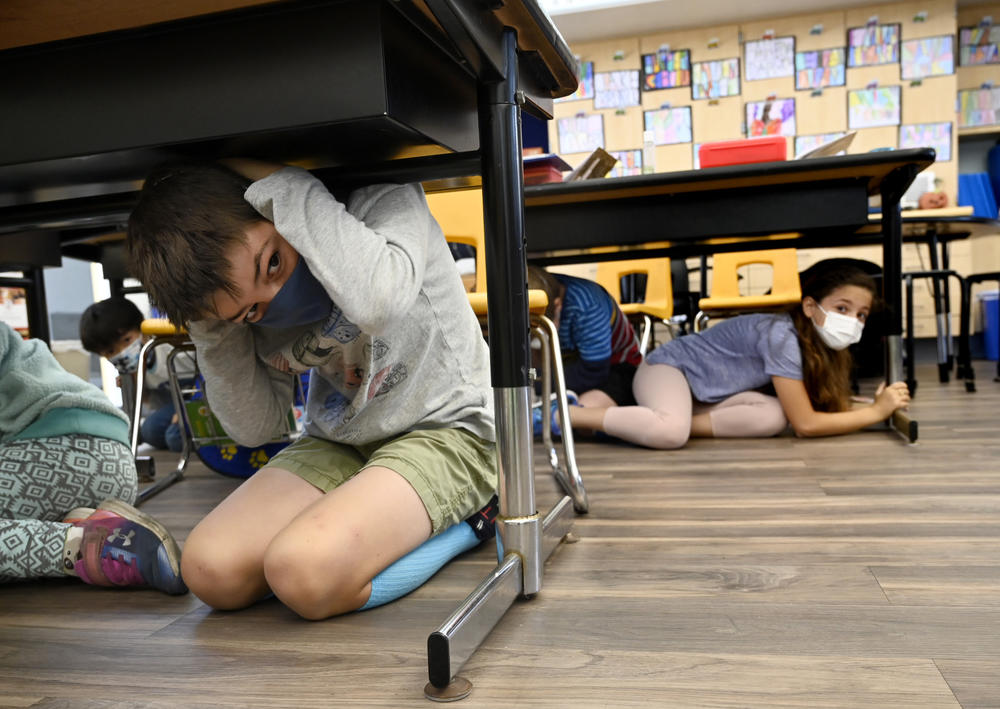 Third grade students in Mrs. Jordan's class participate in the Great Shakeout annual earthquake drill at Pacific Elementary School in Manhattan Beach on Thursday, October 21, 2021.