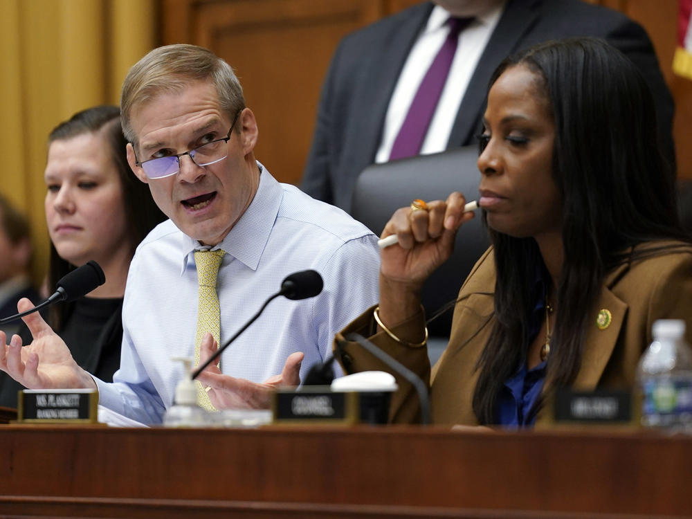 Chairman Jim Jordan, R-Ohio, left, speaks as Del. Stacey Plaskett, D-Virgin Islands, the ranking member, right, listens, during a House Judiciary subcommittee hearing on what Republicans say is the politicization of the FBI and Justice Department and attacks on American civil liberties.