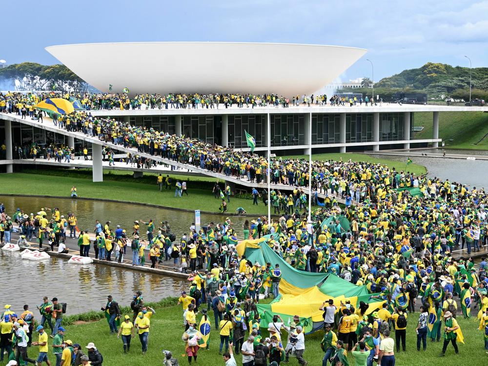 Supporters of Brazilian former President Jair Bolsonaro hold a demonstration at the Esplanada dos Ministerios in Brasilia last month.