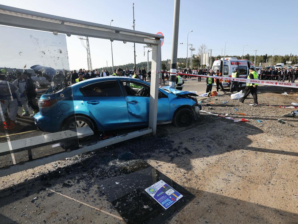 Israeli emergency responders gather at the scene in Jerusalem.