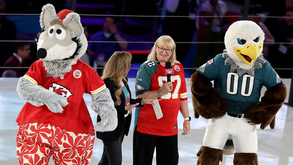 Donna Kelce (center), mother of Philadelphia Eagles' Jason Kelce and Kansas City Chiefs' Travis Kelce, speaks on stage during Super Bowl LVII Opening Night on Monday in Phoenix.