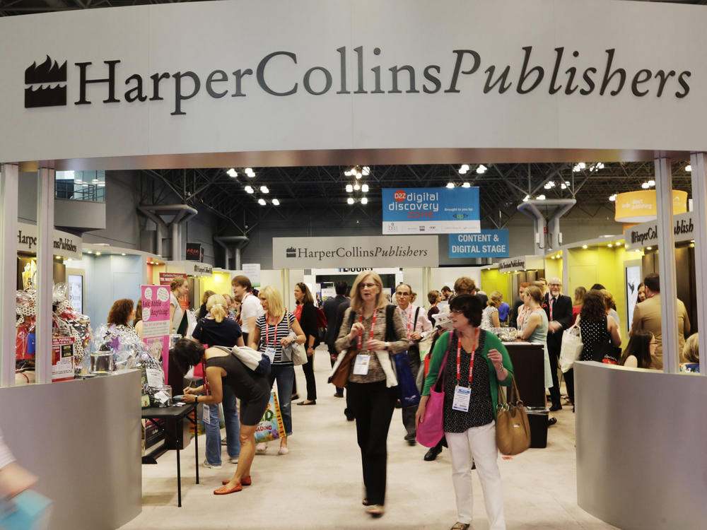 Attendees at BookExpo America visit the HarperCollins Publishers booth in New York on May 28, 2015.