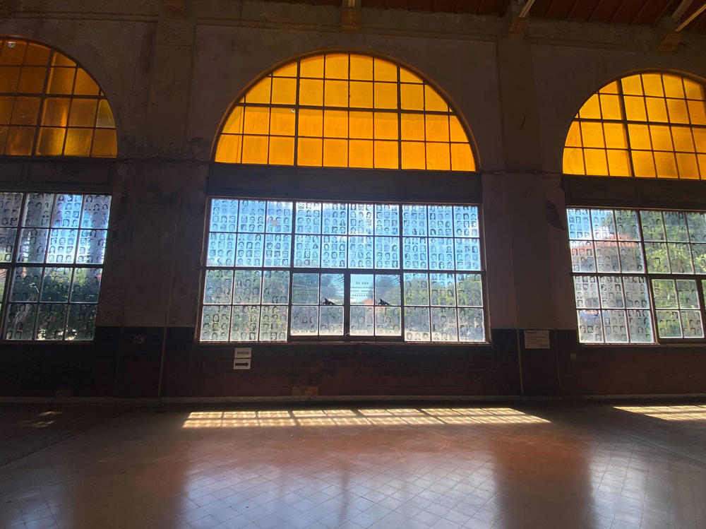 In the main hall of the former ESMA, the windows are filled with images of civilians who were detained, tortured and killed here. Because their captivity was never acknowledged by the regime, they are known as 