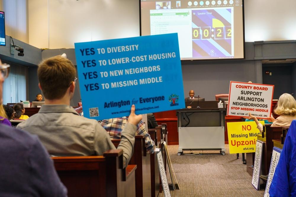 Supporters and opponents of a proposed plan to eliminate most single-family zoning in Arlington, Va., attend a public hearing on Jan. 21. This photo first appeared in DCist. Click <a href=