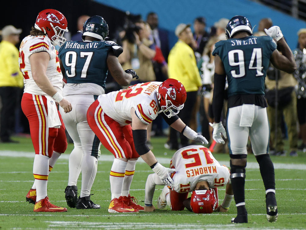 Patrick Mahomes #15 of the Kansas City Chiefs lays on the field after reinjuring his ankle during the second quarter against the Philadelphia Eagles in Super Bowl LVII at State Farm Stadium on February 12, 2023 in Glendale, Ariz.