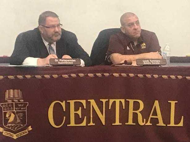 Former Central Regional School District Superintendent Triantafillos Parlapanides, left, and Board of Education President Louis Tuminaro listen to speakers at a March 17, 2022 board meeting.
