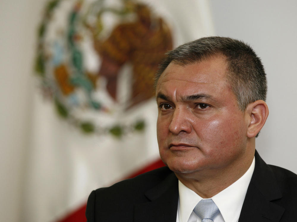 In this Oct. 8, 2010 file photo, Mexico's Secretary of Public Safety Genaro Garcia Luna attends a press conference on the sidelines of an American Police Community meeting in Mexico City. Garcia Luna, who is in custody and facing drug trafficking charges in New York, has been charged in a superseding indictment with continuing criminal enterprise.